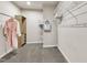 Spacious walk-in closet with carpeted floors, with wooden storage shelves and hanging rods, offering ample storage at 1230 Wingstem Pl, Raleigh, NC 27607