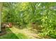 The backyard offers a private, peaceful space with a wooden deck perfect for outdoor relaxation at 1305 Montreux Ct, Mebane, NC 27302