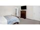 Bedroom featuring carpet, natural light from a window, and a dresser with a mounted television at 1305 Montreux Ct, Mebane, NC 27302