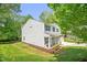 Well-maintained home with lush green lawn, complimented by mature shade trees and an inviting exterior at 1305 Montreux Ct, Mebane, NC 27302