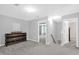 Second floor hallway with neutral colored walls and carpet, and doorways to other rooms at 1305 Montreux Ct, Mebane, NC 27302