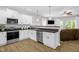 Bright kitchen with white cabinets, modern appliances, stainless steel dishwasher, and durable countertops at 1305 Montreux Ct, Mebane, NC 27302