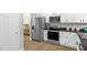Stylish kitchen featuring stainless steel appliances and ample cabinet space at 1305 Montreux Ct, Mebane, NC 27302
