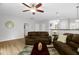 Open living space with a ceiling fan, lots of seating, and easy access to other rooms at 1305 Montreux Ct, Mebane, NC 27302
