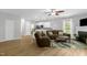 Open-concept living room and kitchen with a cozy fireplace at 1305 Montreux Ct, Mebane, NC 27302