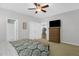 Cozy main bedroom with a ceiling fan, large closet, and access to the en suite bathroom at 1305 Montreux Ct, Mebane, NC 27302