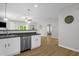 Open floorplan with modern kitchen flowing into the cozy living area at 1305 Montreux Ct, Mebane, NC 27302