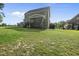 Expansive backyard showing the home's screened porch and deck, great for Gathering gatherings and relaxation at 140 Barletta Ct, Clayton, NC 27527