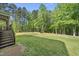 Picture of the expansive backyard, with lush green grass and a view into the woods at 140 Barletta Ct, Clayton, NC 27527