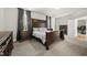 Bedroom with carpet, dark wood furniture, and two windows at 140 Barletta Ct, Clayton, NC 27527