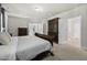 Bedroom with carpet, dark wood furniture, and multiple closets at 140 Barletta Ct, Clayton, NC 27527