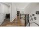 Hallway view with hardwood floors looking at laundry room at 140 Barletta Ct, Clayton, NC 27527