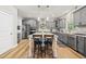 Stylish kitchen with gray cabinetry, stainless steel appliances, and a center island at 140 Barletta Ct, Clayton, NC 27527