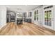 Spacious kitchen with stainless steel appliances, gray cabinets, island seating, and backyard access at 140 Barletta Ct, Clayton, NC 27527