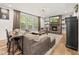 Comfortable living room with a stone fireplace, mounted TV, and stylish furnishings at 140 Barletta Ct, Clayton, NC 27527