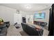 Relaxing living room with a large TV, plush seating and comfortable, neutral carpeting at 140 Barletta Ct, Clayton, NC 27527