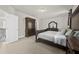 Comfortable main bedroom with dark furniture and neutral carpet at 140 Barletta Ct, Clayton, NC 27527