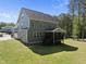 A beautiful home exterior featuring a screened porch and a well-maintained lawn at 140 Barletta Ct, Clayton, NC 27527