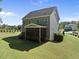 Back exterior of the house featuring a screened porch perfect for outdoor relaxation and shade at 140 Barletta Ct, Clayton, NC 27527