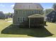 Rear exterior showcasing a screened-in porch, siding, and stairs descending to the yard at 140 Barletta Ct, Clayton, NC 27527