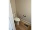 Cozy half bathroom with wood grain vinyl flooring and gold fixtures at 1403 Cottondale Lane, Wake Forest, NC 27587