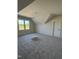 Bedroom with plush carpet, large windows, and ample natural light at 1403 Cottondale Lane, Wake Forest, NC 27587