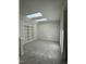 Bonus room featuring carpeted floors, built-in shelving and two skylights for lots of natural light at 1403 Cottondale Lane, Wake Forest, NC 27587
