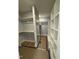 Spacious walk-in closet with custom white shelving, ample storage, and a full-length mirror at 1403 Cottondale Lane, Wake Forest, NC 27587