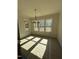 Bright dining room with shiplap walls, large windows, and elegant pendant lighting at 1403 Cottondale Lane, Wake Forest, NC 27587