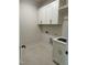Bright laundry room with sink, white cabinets, and ample space for appliances at 1403 Cottondale Lane, Wake Forest, NC 27587