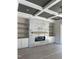Living room featuring a modern fireplace with decorative tile and open shelving, creating a focal point at 1403 Cottondale Lane, Wake Forest, NC 27587