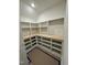 Walk-in pantry with custom built-in shelving, wooden countertops and ample storage at 1403 Cottondale Lane, Wake Forest, NC 27587
