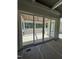Screened porch with wood ceiling and view of the wooded backyard, providing a cozy outdoor living space at 1403 Cottondale Lane, Wake Forest, NC 27587