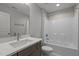 Clean bathroom features vanity, tub/shower combo, and plenty of lighting at 145 Leisure Ln # 12, Louisburg, NC 27549