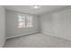 Comfortable bedroom with natural light from window and double door closet at 145 Leisure Ln # 12, Louisburg, NC 27549