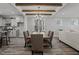 Dining area featuring wood table, chandelier, views of trees, and an open concept layout at 145 Leisure Ln # 12, Louisburg, NC 27549