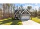Charming two-story home with symmetrical roofline, white trim, and two car garage at 145 Leisure Ln # 12, Louisburg, NC 27549