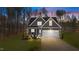 Charming two-story home with symmetrical roofline, white trim, and two car garage at 145 Leisure Ln # 12, Louisburg, NC 27549