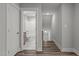 Hallway leading to bathroom with stairway access to the second floor at 145 Leisure Ln # 12, Louisburg, NC 27549