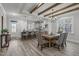 Open concept dining room, kitchen and living area with hardwood flooring and bright, natural light at 145 Leisure Ln # 12, Louisburg, NC 27549