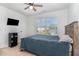 Relaxing bedroom with natural light, a cozy bed, and neutral decor at 150 Sherrill Place Ln, Garner, NC 27529