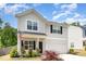 Attractive two-story home with well-manicured landscaping and an inviting entrance at 150 Sherrill Place Ln, Garner, NC 27529