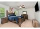 Comfortable main bedroom with a large bed, ceiling fan, and natural light from the windows at 150 Sherrill Place Ln, Garner, NC 27529