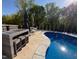 Inviting backyard pool with custom patio and outdoor bar area for entertaining at 150 Sherrill Place Ln, Garner, NC 27529