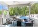 Cozy screened porch overlooking the beautiful backyard and sparkling pool at 150 Sherrill Place Ln, Garner, NC 27529
