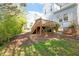 Exterior view of the home's backyard and wood deck at 1601 Dunraven Dr, Raleigh, NC 27612