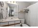 This bathroom features a shower and updated fixtures at 1601 Dunraven Dr, Raleigh, NC 27612