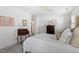 Neutral bedroom with a bed, dresser, and a window with shutters at 1601 Dunraven Dr, Raleigh, NC 27612
