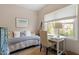Bright bedroom with daybed, desk, large window, neutral colors, and natural light at 1601 Dunraven Dr, Raleigh, NC 27612