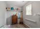 Closet area has shelving and laminate flooring at 1601 Dunraven Dr, Raleigh, NC 27612